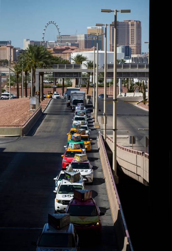 Taxis line up at McCarran International Airport ahead of the Labor Day holiday weekend in Las V ...