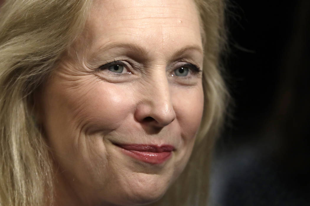 Democratic presidential candidate Sen. Kirsten Gillibrand, D-N.Y., listens to a reporter's ques ...