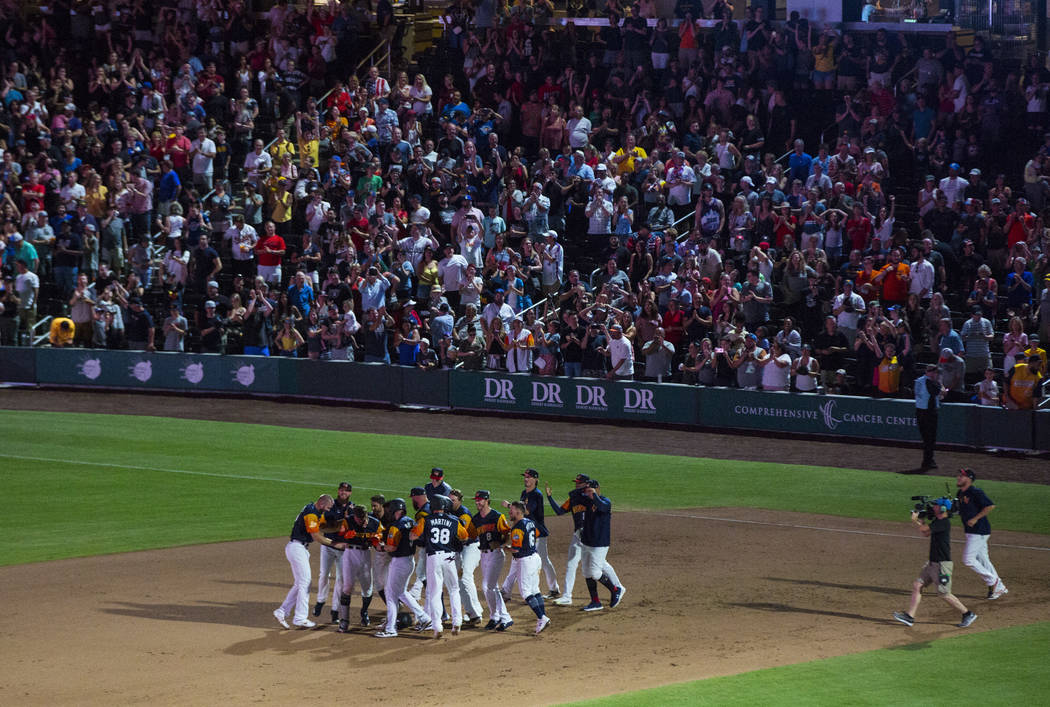 The Las Vegas Aviators celebrate their 3-2 walk-off win over the Reno Aces at the Las Vegas Bal ...