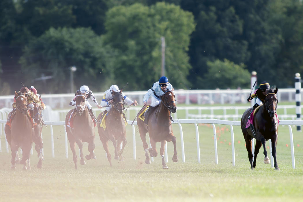 Julio Garcia, from right, riding Bound for Nowhere, and James Graham, riding Great Wide Open, l ...