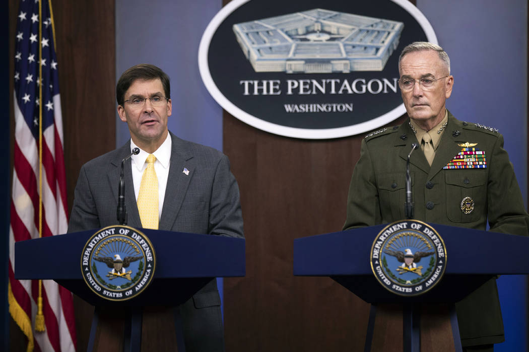 Secretary of Defense Mark Esper and Joint Chiefs Chairman Gen. Joseph Dunford speak to reporter ...