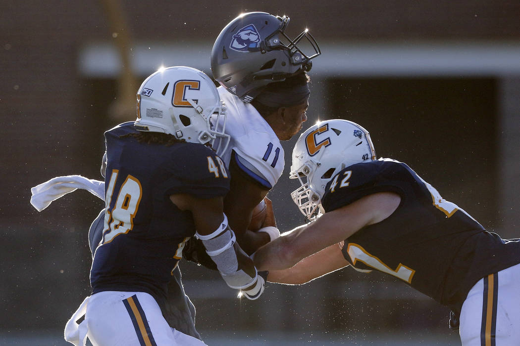 Eastern Illinois quarterback Johnathan Brantley (11) loses his helmet as he is hit by Chattanoo ...