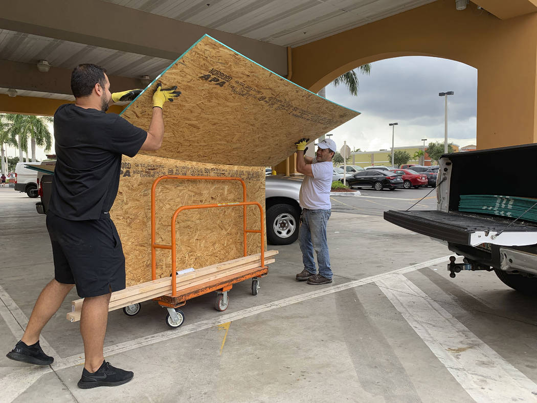 Shoppers load their truck with supplies to prepare ahead of Hurricane Dorian at The Home Depot ...