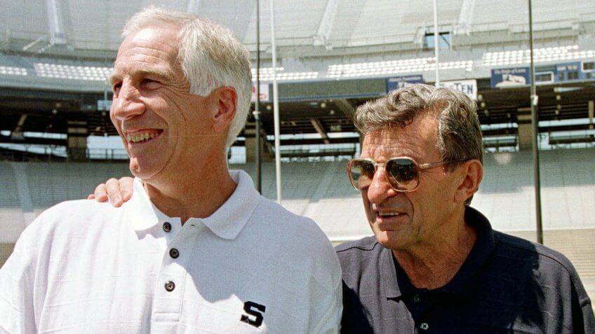 Jerry Sandusky and Joe Paterno in 1999. (Paul Vathis/AP/Shutterstock.com)