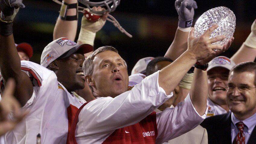 Ohio State coach Jim Tressel holds 2003 Fiesta Bowl championship trophy. (Paul Sakuma/AP/Shutte ...