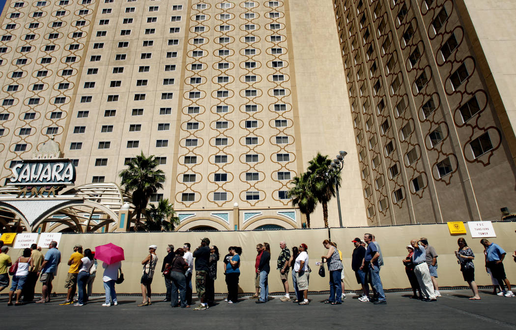 People stand in line to purchase memorabilia from the closed Sahara hotel-casino on the Las Veg ...