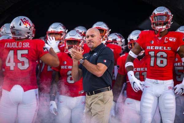 UNLV Rebels head coach Tony Sanchez waits with his team to take the field versus Southern Utah ...