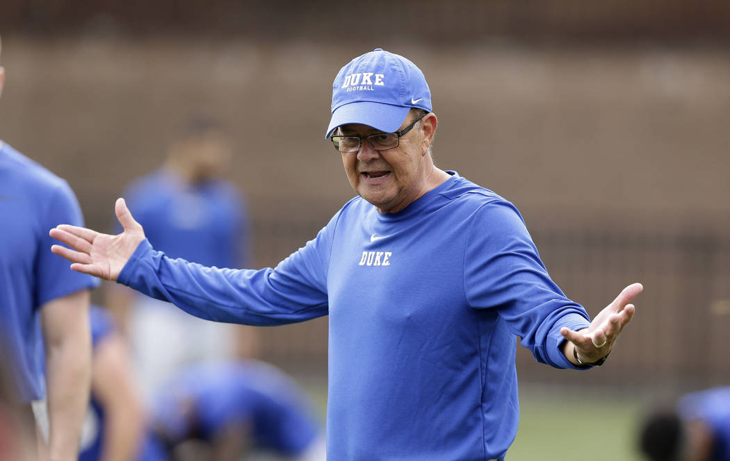 This photo taken Friday, Aug. 2, 2019, shows Duke head coach David Cutcliffe directs his player ...