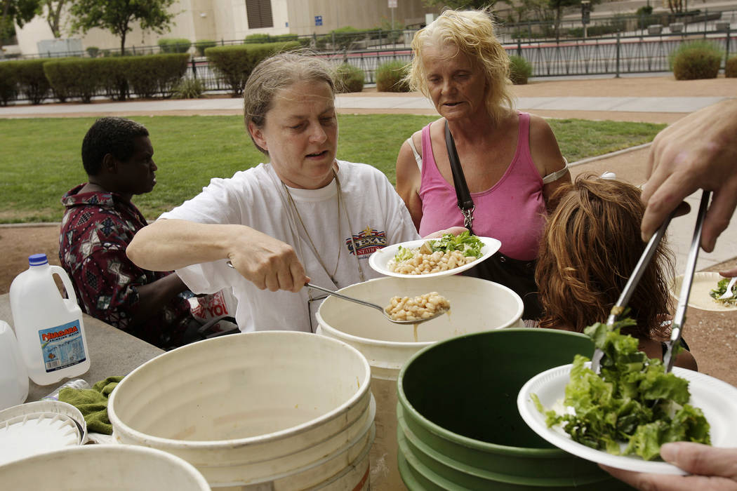Homeless advocate Gail Sacco, left, feeds the homeless at Frank Wright Plaza in 2007 in downtow ...