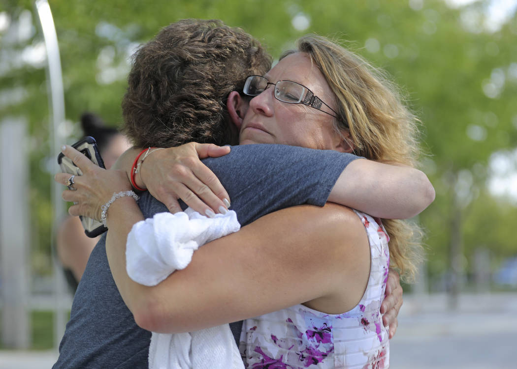 Tova Keblish, right, hugs Kelli Anderson Young, outside the federal courthouse after a jury rea ...