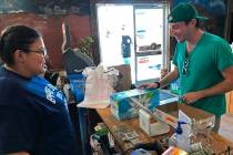 Jeremy Keesh, a Burning Man attendee from Chicago, buys coconut water at the Empire Store from ...