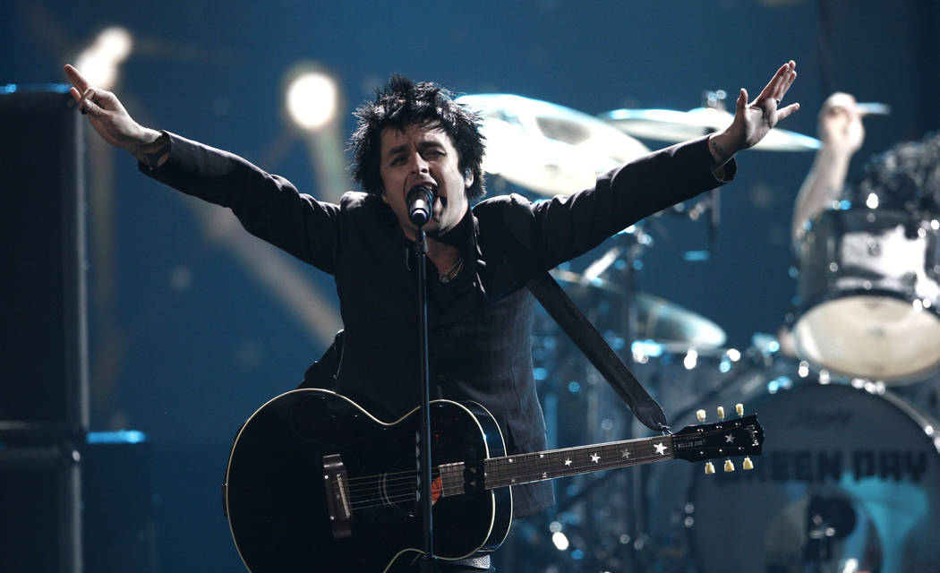 Billie Joe Armstrong, from Green Day, performs at the 37th Annual American Music Awards on Sun ...