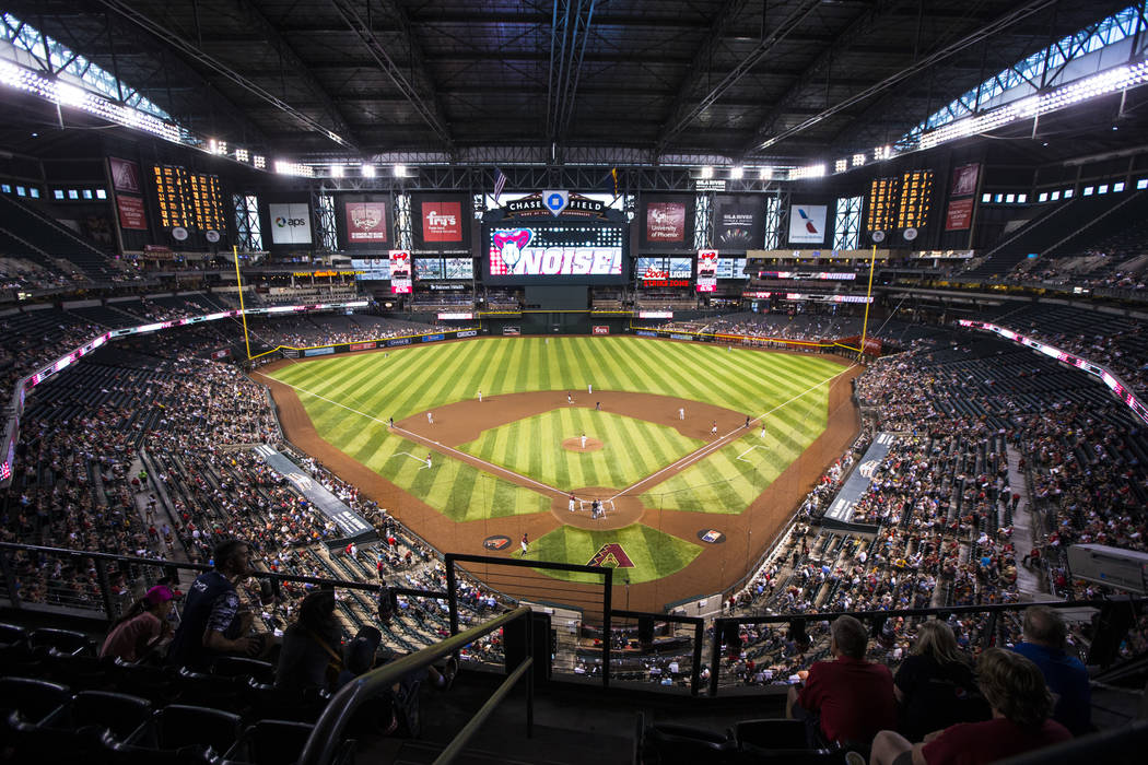 Fans watch the action during an Arizona Diamondbacks baseball game against the Philadelphia Phi ...