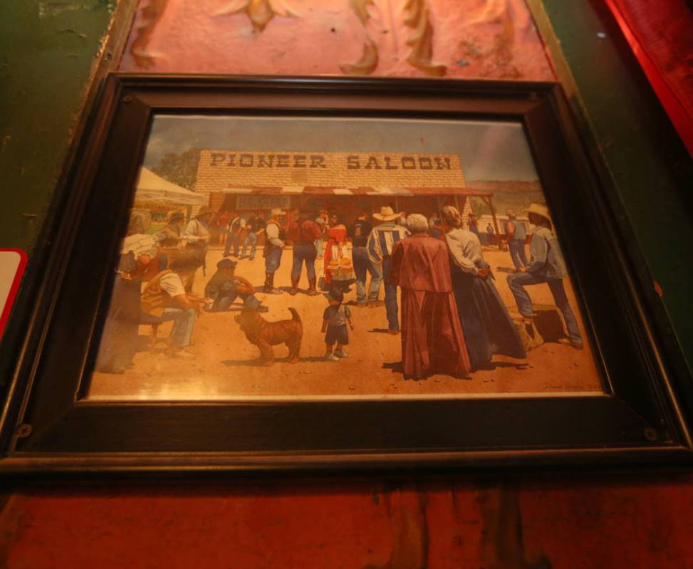 A framed painting hangs in the dining room of the Pioneer Saloon in Goodsprings, July 31, 2019. ...