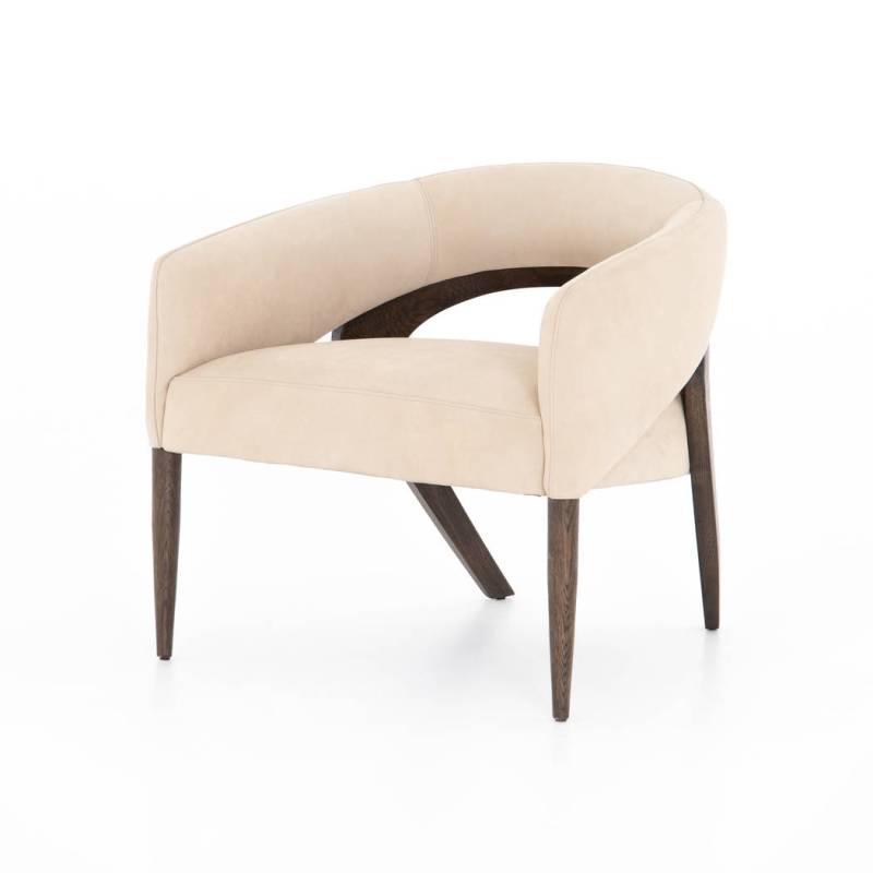 The Atlas Chair from Four Hands comes in nubuck sand with brown oak framing that curves into ex ...