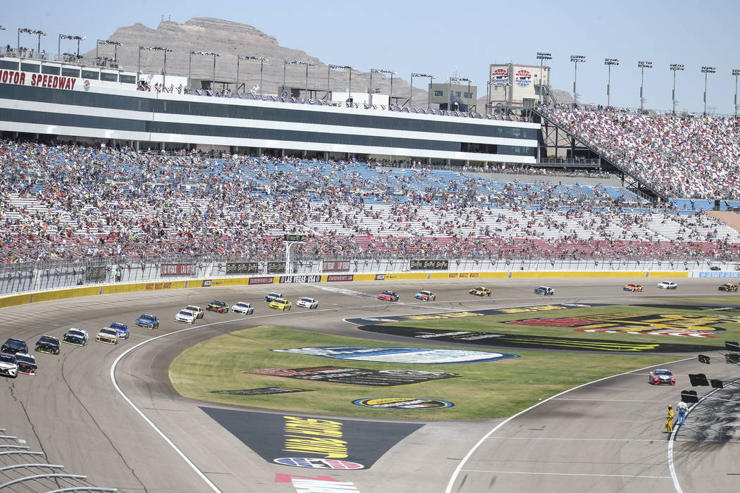 Race fans watch the South Point 400 NASCAR Cup Series auto race at the Las Vegas Motor Speedway ...