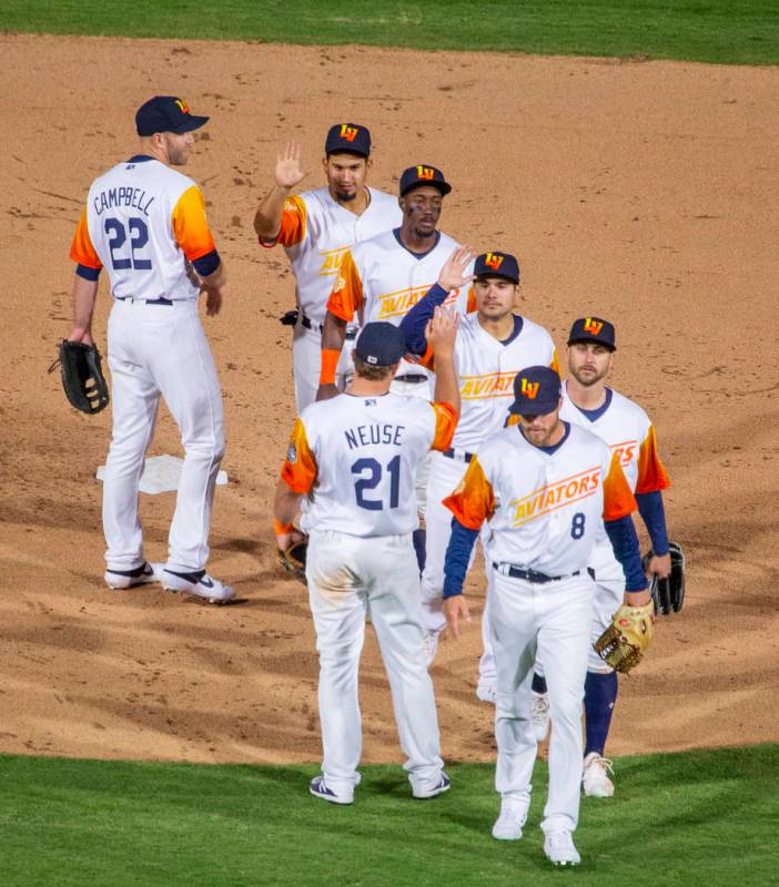 The Las Vegas Aviators celebrate their home opener win over the Sacramento River Cats on Tuesda ...