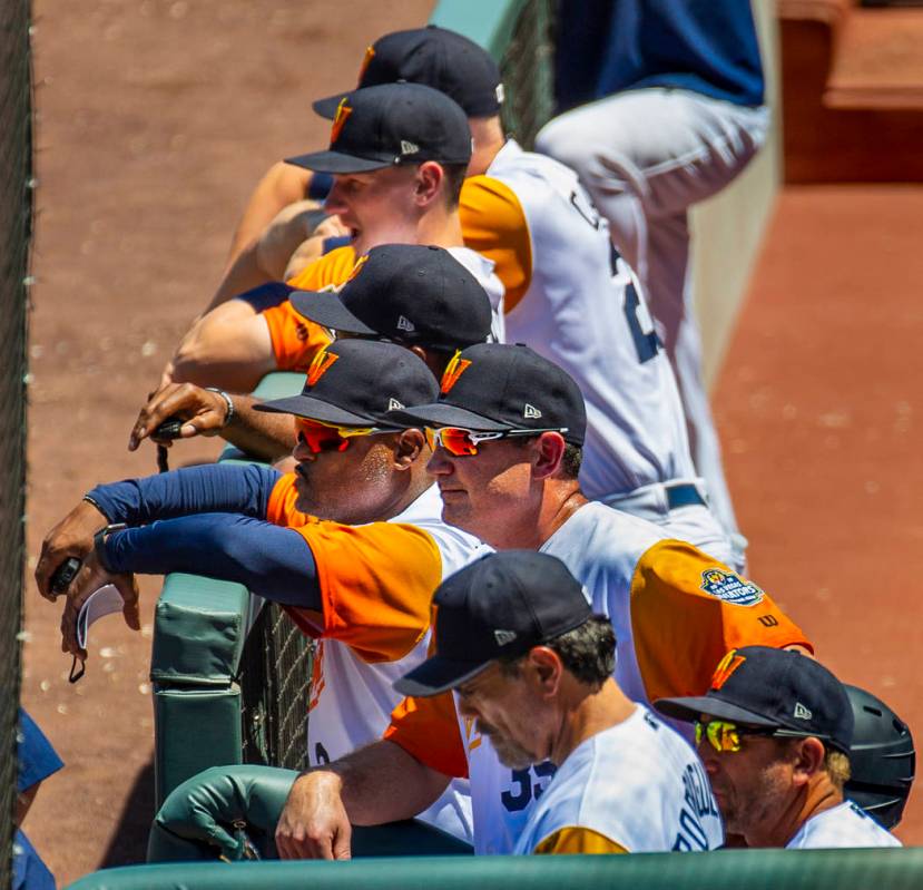 Aviators manager Fran Riordan (39) (center) is joined by others watching their team bat versus ...