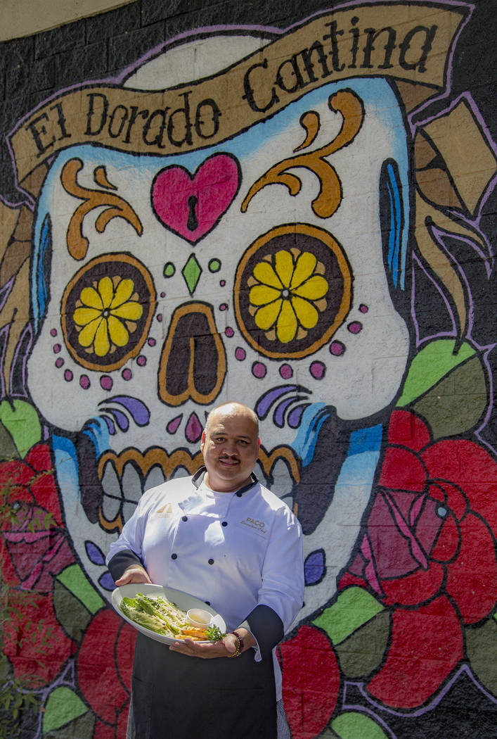 Chef Paco Cortes holds the Tableside Caesar Salad at El Dorado Cantina Restaurant & Bar in ...