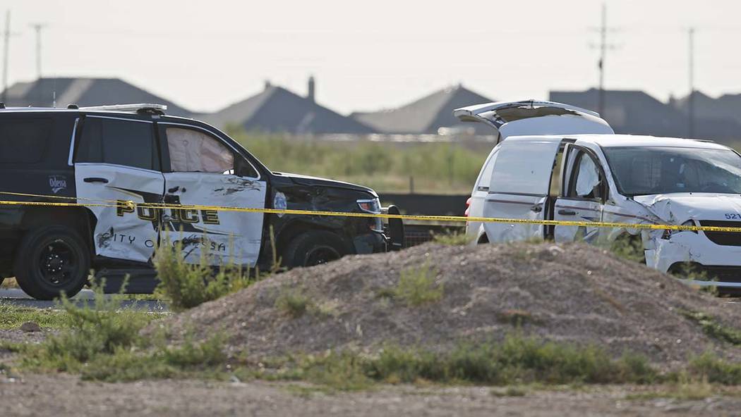 A city of Odessa police car, left, and a U.S. mail vehicle, right, which were involved in Satur ...