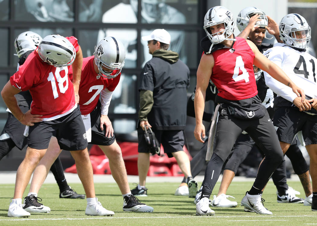 Oakland Raiders quarterback, from left, Nathan Peterman (18), Mike Glennon (7) and Derek Carr ( ...