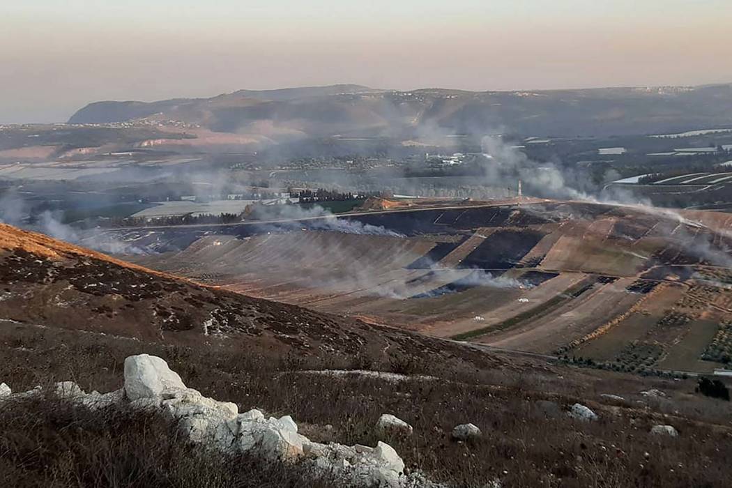 Smoke rises from Israeli army shells that landed in the southern Lebanese border village of Mar ...