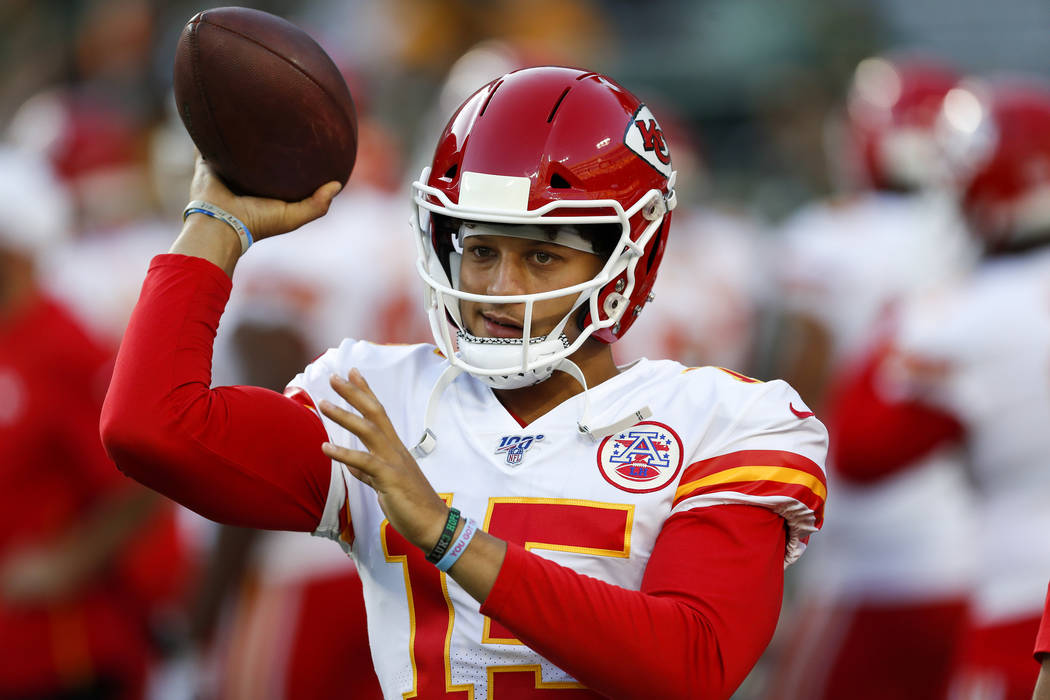 Kansas City Chiefs' Patrick Mahomes warms up before a preseason NFL football game against the G ...