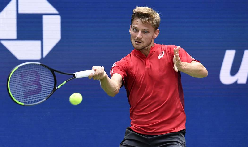 David Goffin, of Belgium, returns to Roger Federer, of Switzerland, during the fourth round of ...