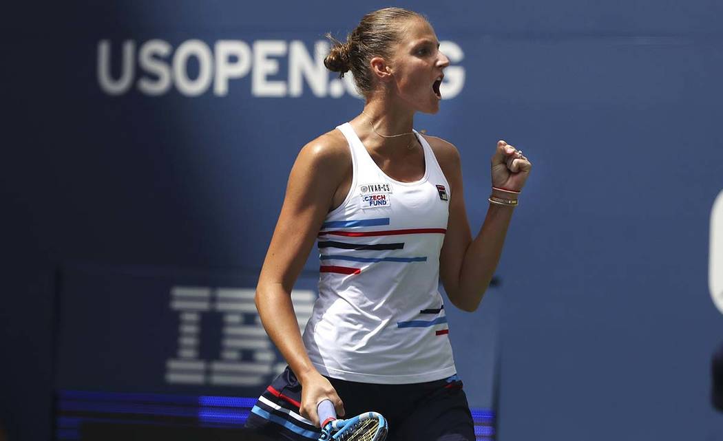 Karolina Pliskova, of the Czech Republic, pumps her fist after wining a point against Johanna K ...
