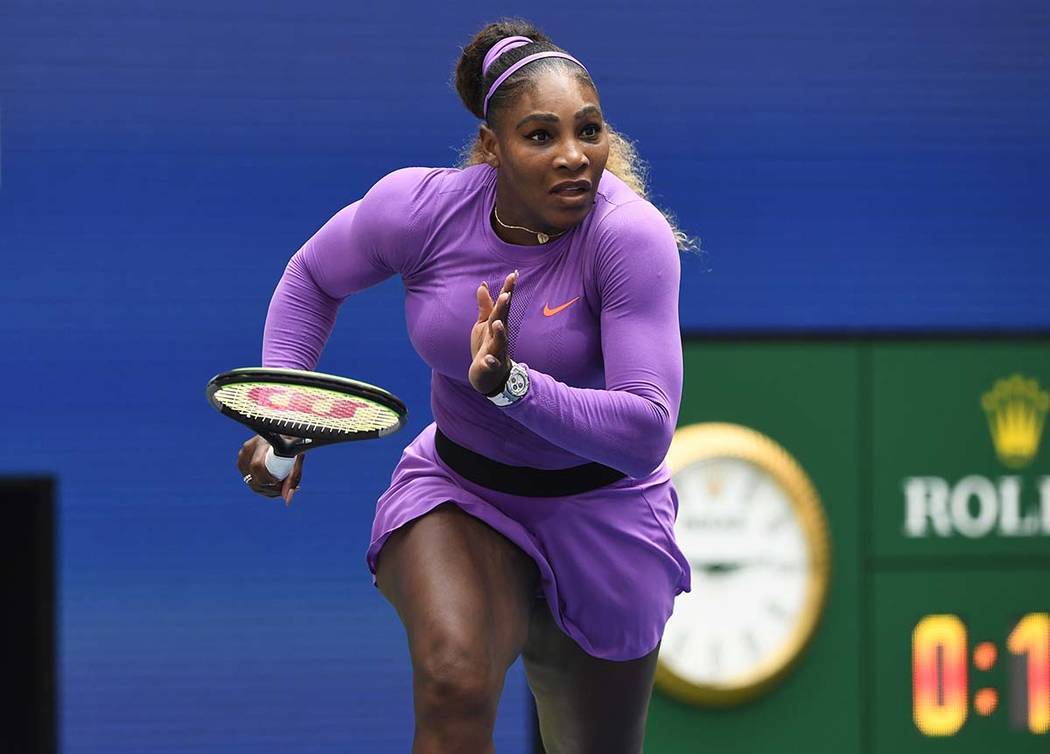 Serena Williams, of the United States, dashes to the net on a return to Petra Martic, of Croati ...