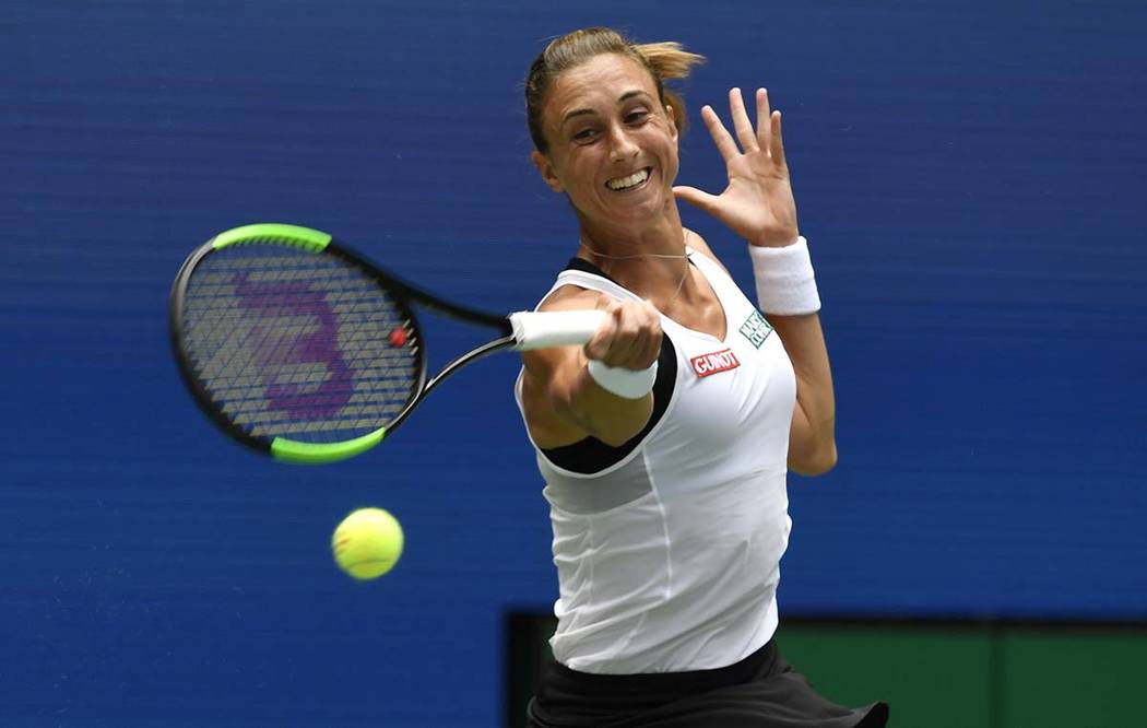 Petra Martic, of Croatia, returns to Serena Williams, of the United States, during round four o ...