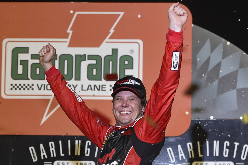 Erik Jones celebrates his victory after a NASCAR Cup Series auto race on Sunday, Sept. 1, 2019, ...