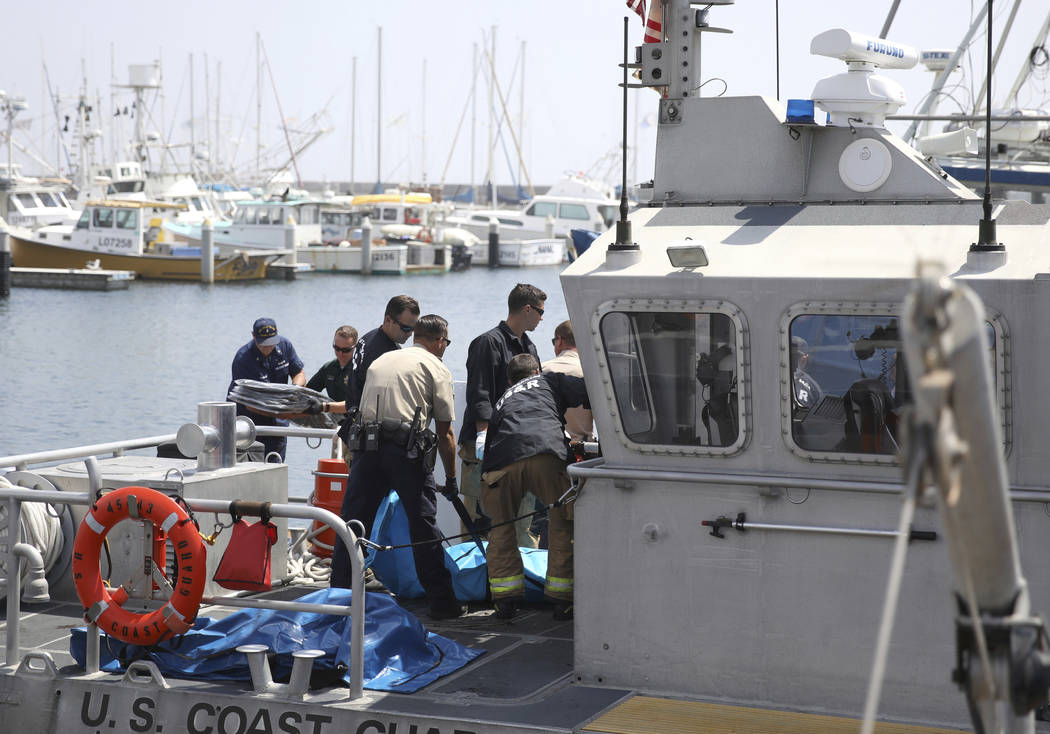 Santa Barbara City Search and Rescue along with Santa Barbara Sheriff officers move a recovered ...