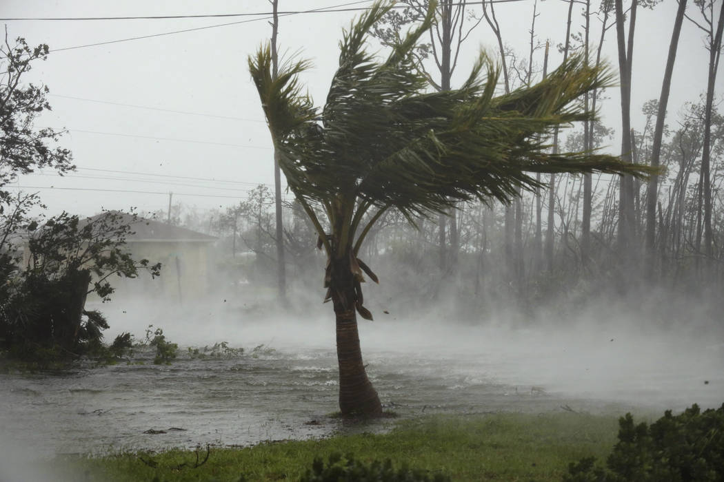 A road is flooded during the passing of Hurricane Dorian in Freeport, Grand Bahama, Bahamas, Mo ...