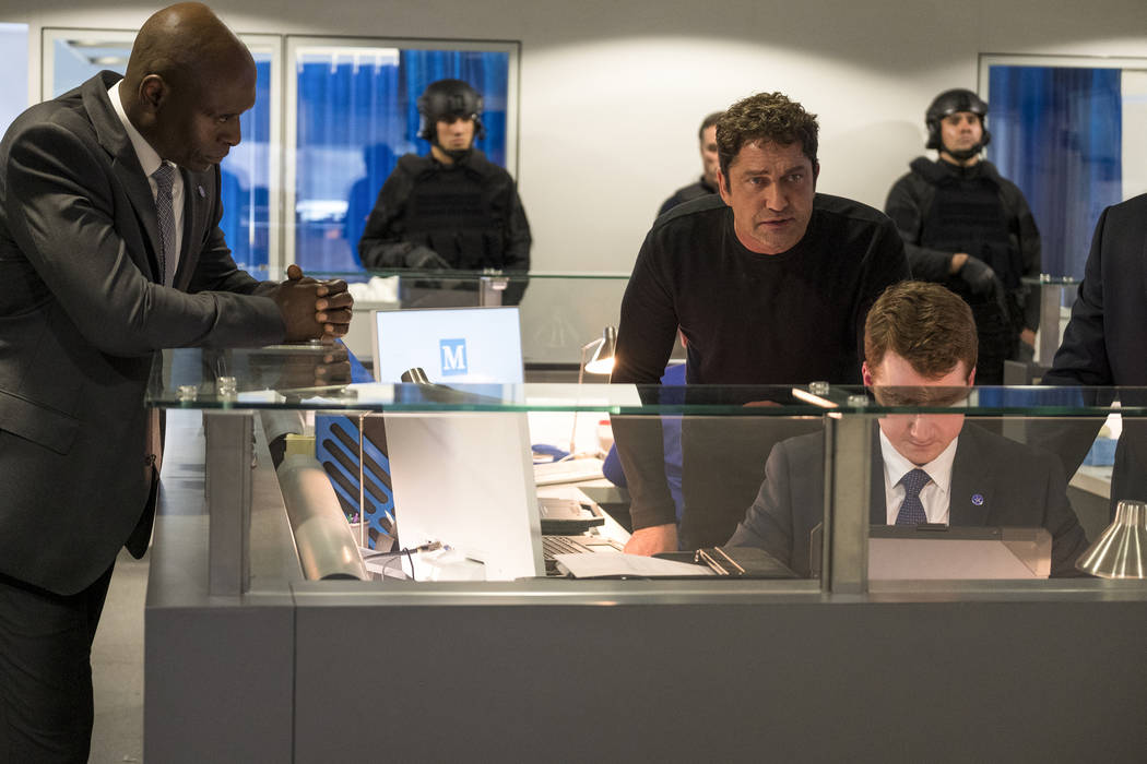 This image released by Lionsgate shows Lance Reddick, left, and Gerard Butler in "Angel Ha ...