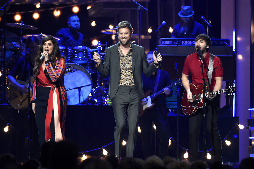 Hillary Scott, from left, Charles Kelley, and Dave Haywood, of Lady Antebellum, perform at the ...