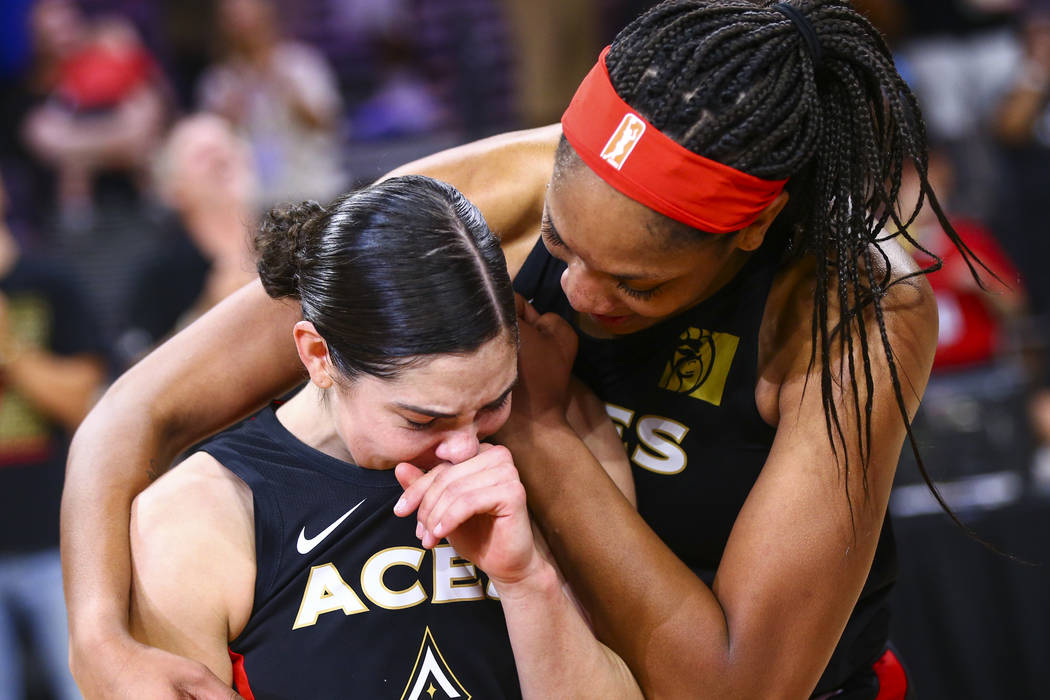 Las Vegas Aces' A'ja Wilson, right, comforts Kelsey Plum after their win against the Los Angele ...