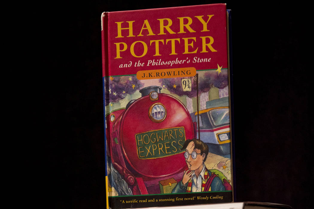This May 20, 2013, file photo shows a first edition copy of the first Harry Potter book "Harry ...