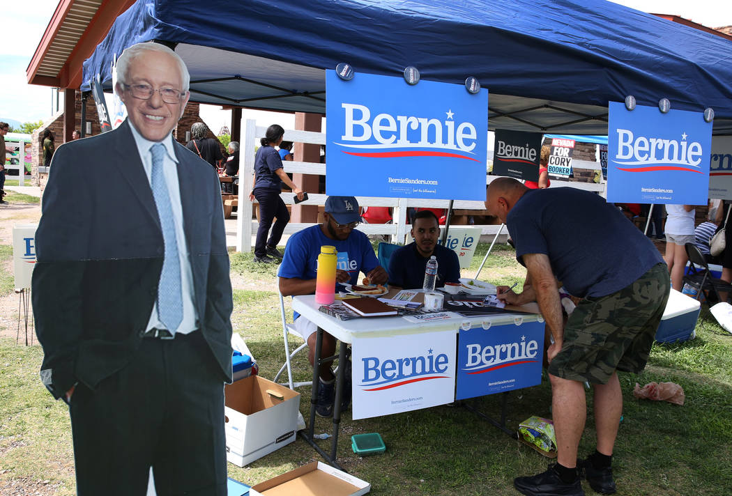 A potential voter, who declined to give his name, fills out forms at Democratic presidential ca ...