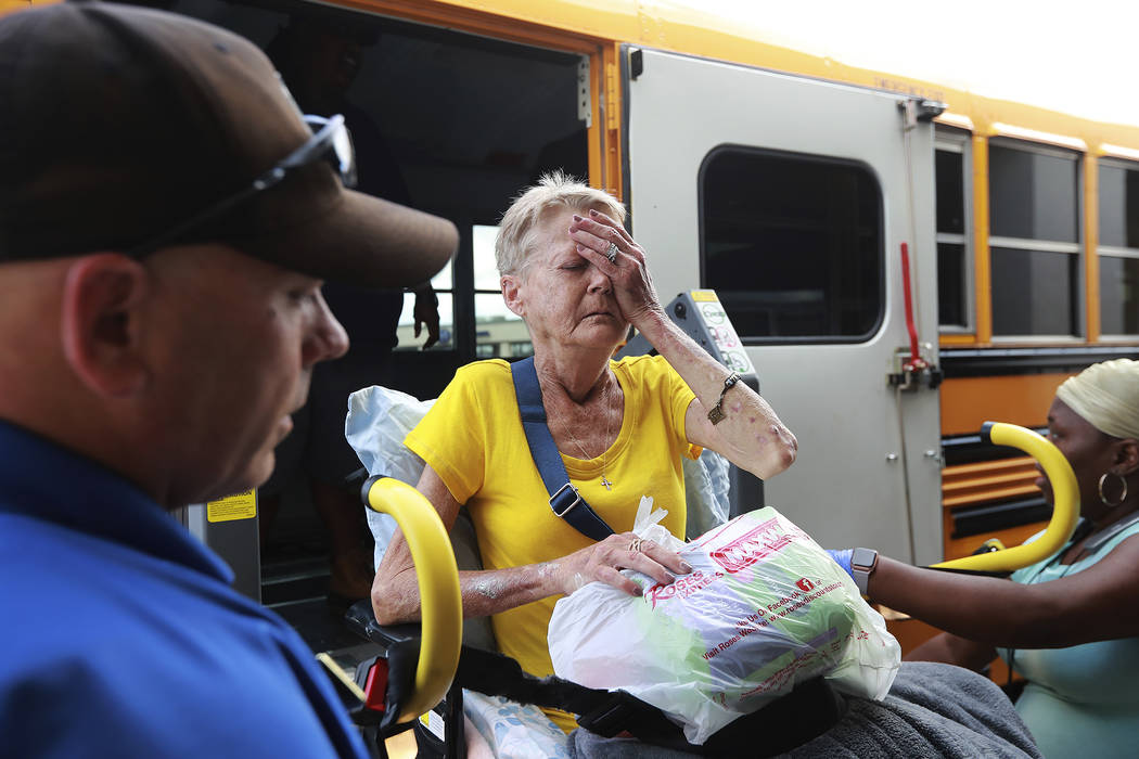 Glynn County school resource officer Mark Hooper, left, and school support staff member Sheree ...