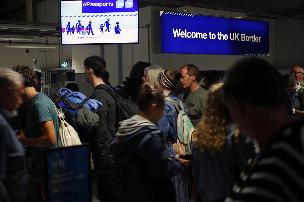 In this picture taken Saturday, Aug. 31, 2019, passengers arrive at Edinburgh Airport, in Edinb ...