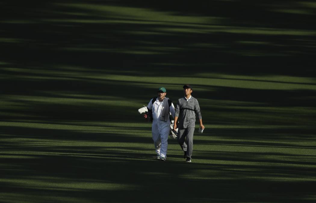 Doug Ghim walks down the second fairway during the second round at the Masters golf tournament ...