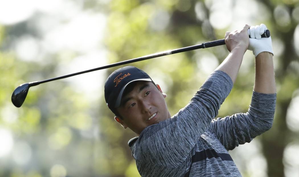 Doug Ghim hits on the fourth tee during the second round at the Masters golf tournament Friday, ...