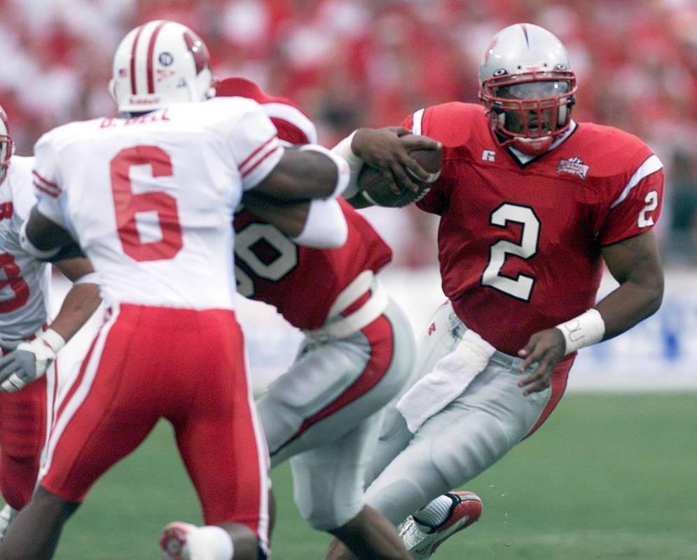 UNLV quarterback Jason Thomas scrambles in the first quarter against Wisconsin Saturday, Aug. 3 ...