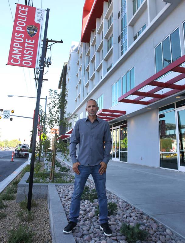 Frank Marretti, founder of G2 Capital Development, poses for a photo in font of a new apartment ...