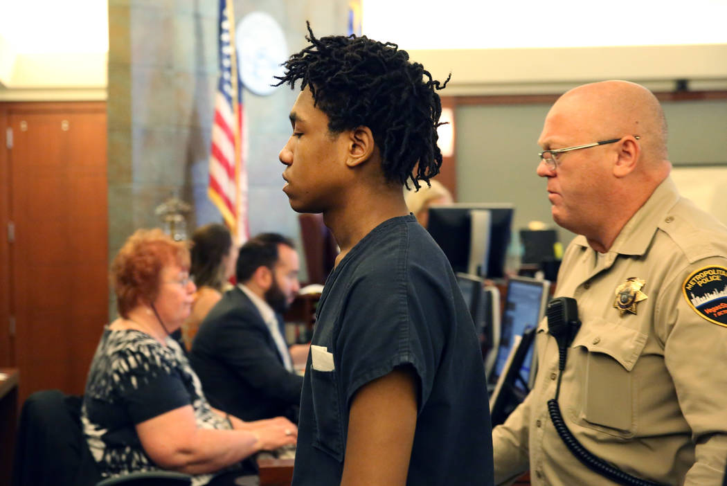 Damion Dill, accused of killing 11-year-old Angelina Erives, led out of the courtroom after his ...