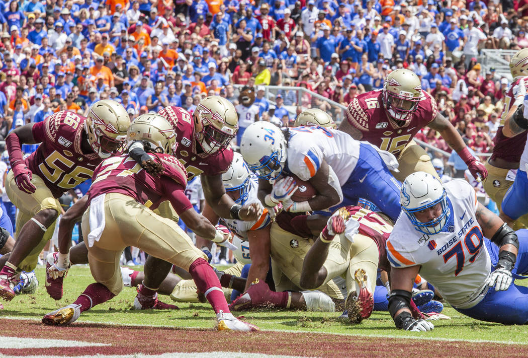 Boise State Broncos running back Robert Mahone (34) dives for the end zone in the 1st half of a ...