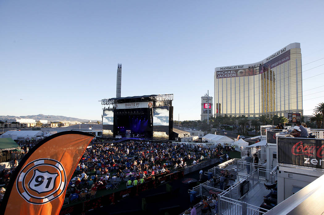 Fans listen to Dustin Lynch perform at the Route 91 Harvest country music festival at the MGM R ...