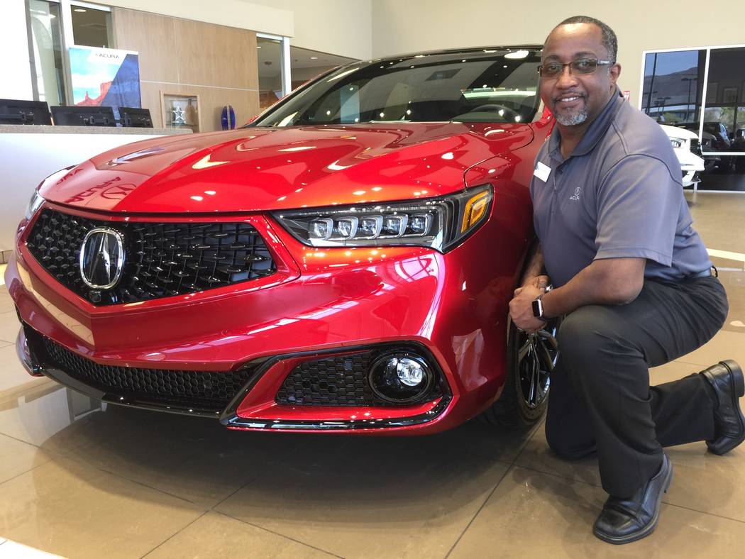 Veteran sales manager John Williams is seen with the 2020 Acura TLX PMC Edition at Findlay Acur ...