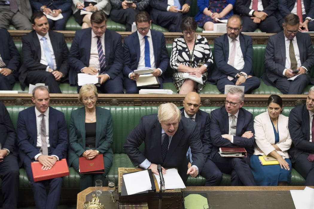 In this image released by the House of Commons, Britain's Prime Minister Boris Johnson speaks i ...